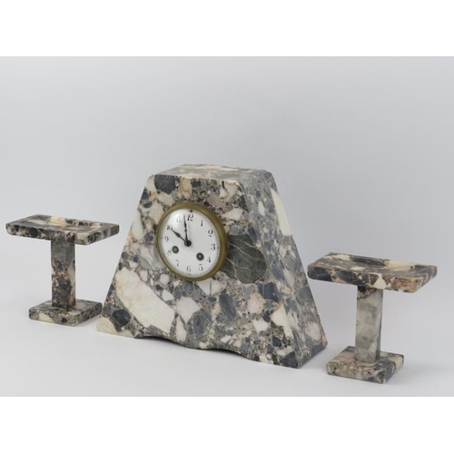 6 - A large French Art Deco marble clock of trapezoidal pyramid form with two mating stands, early 20th ... 