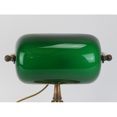 76 - A vintage brass bankers office table lamp light. With adjustable green glass shade. 31 cm height. 
C... 