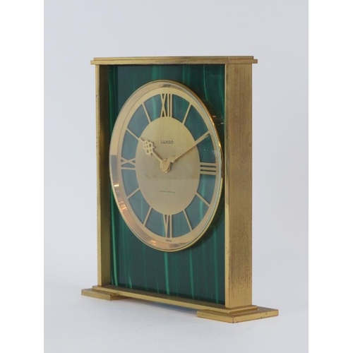 84 - A vintage Swiss Luxor gilt brass and faux malachite desk clock with retailers mark of Mappin & Webb.... 