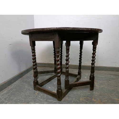 701 - A 17th century Charles II oak gate-leg table of good colour, on barley twist supports with stretcher... 