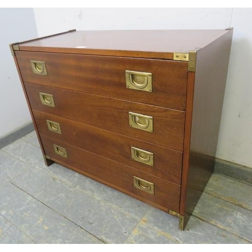 704 - A vintage mahogany brass mounted military style chest, housing four long drawers with recessed brass... 