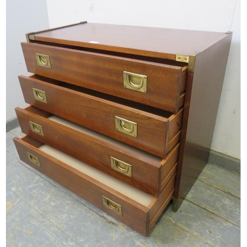 704 - A vintage mahogany brass mounted military style chest, housing four long drawers with recessed brass... 