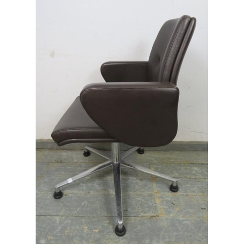 705 - A mid-century style swivel desk chair, upholstered in buttoned brown leather, on cast aluminium supp... 