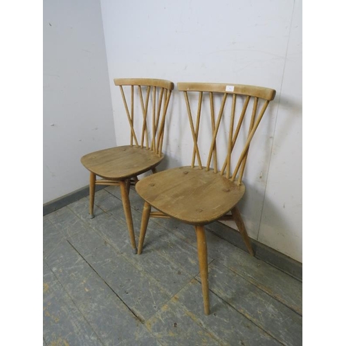 706 - A pair of mid-century elm & beech Windsor ‘candlestick’ chairs by Ercol, the curved lattice backs ab... 