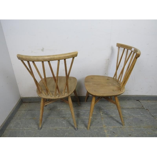 706 - A pair of mid-century elm & beech Windsor ‘candlestick’ chairs by Ercol, the curved lattice backs ab... 