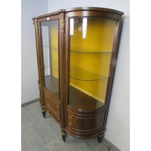 707 - A vintage French mahogany gilt metal mounted bow-fronted vitrine/display cabinet, the mustard fabric... 