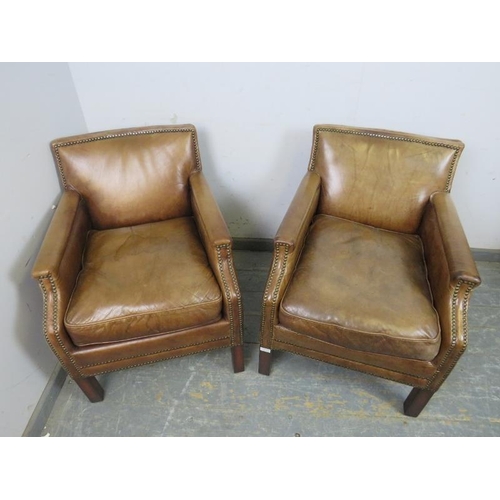 709 - A pair of antique style club chairs, upholstered in distressed brown leather with brass studs, on sq... 