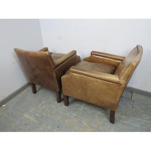 709 - A pair of antique style club chairs, upholstered in distressed brown leather with brass studs, on sq... 