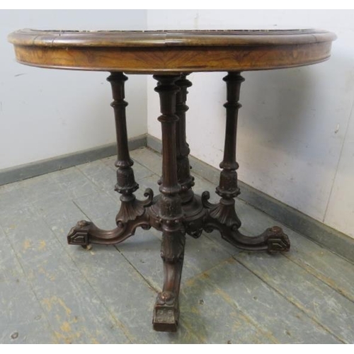 717 - A fine 19th century walnut specimen marble table, the circular top with profuse marble inlay, above ... 