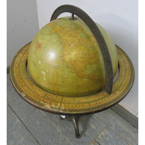 718 - A turn of the century 18” floorstanding library globe by Rand McNally & co, the meridian with monthl... 