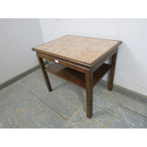 721 - A mid-century walnut tile-topped two-tier side table, on square supports with rounded corners.
H56cm... 