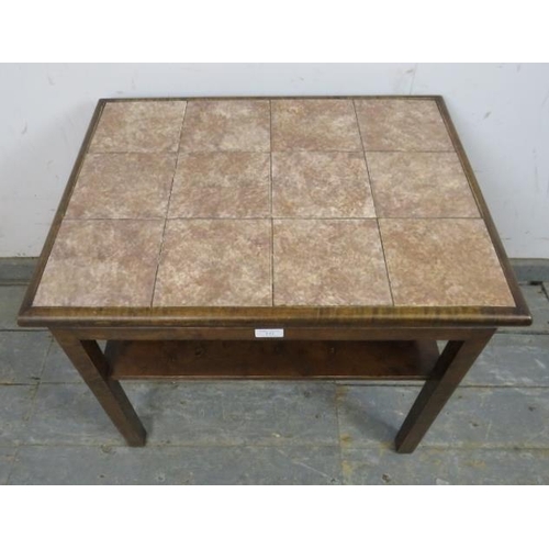 721 - A mid-century walnut tile-topped two-tier side table, on square supports with rounded corners.
H56cm... 