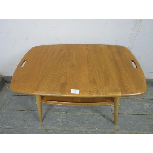 723 - A mid-century elm & beech Windsor butler’s tray table by Ercol, the top with pierced handles to eith... 