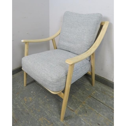 733 - A contemporary Marino lounge chair by Ercol, the bleached ash frame with loose cushions upholstered ... 