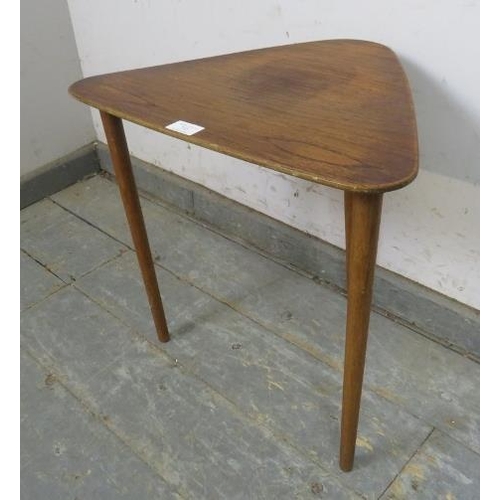 735 - A mid-century teak wine table, the triangular chamfered top on turned supports. 
H44cm W48cm D35cm a... 