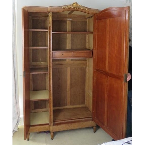 736 - An antique French burr walnut breakfront armoire, having crossbanded inlay and gilt metal mounts, th... 