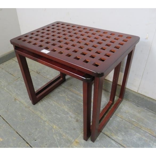 738 - Two vintage nesting coffee tables, the lattice tops on rail supports. 
H43cm W54cm D37cm approx.
Con... 