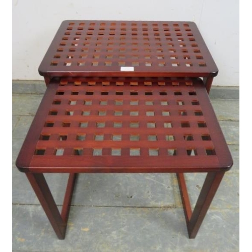 738 - Two vintage nesting coffee tables, the lattice tops on rail supports. 
H43cm W54cm D37cm approx.
Con... 