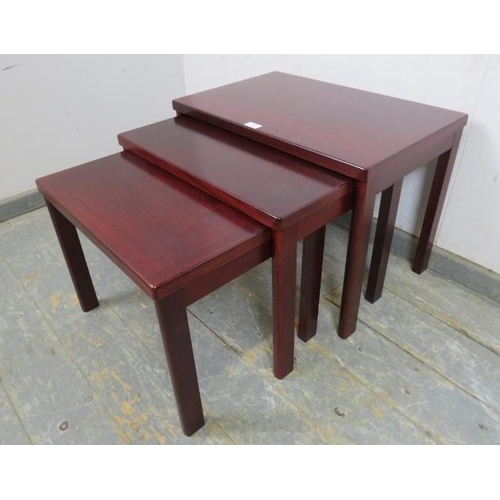 740 - A set of three vintage rectangular nesting tables in the manner of Dyrlund of Denmark. 
H45cm W62cm ... 