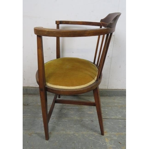 743 - An Edwardian mahogany tub chair strung with satinwood, upholstered in mustard velvet material, on ta... 