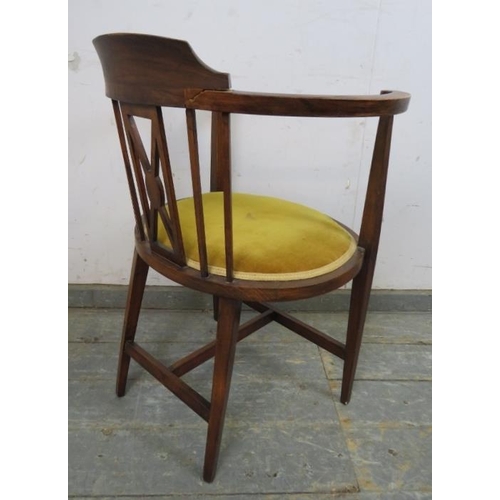 743 - An Edwardian mahogany tub chair strung with satinwood, upholstered in mustard velvet material, on ta... 