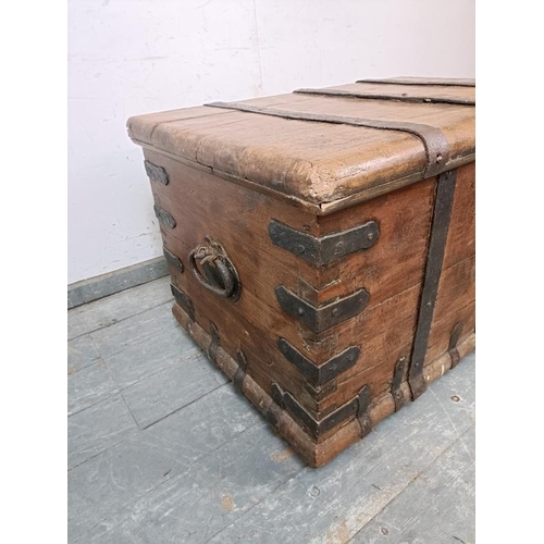 761 - A substantial 18th century oak treasure chest/coffee table, bound in wrought iron strapwork, with ha... 