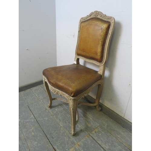 762 - An antique French boudoir chair, the carved and painted frame retaining the original distressed brow... 