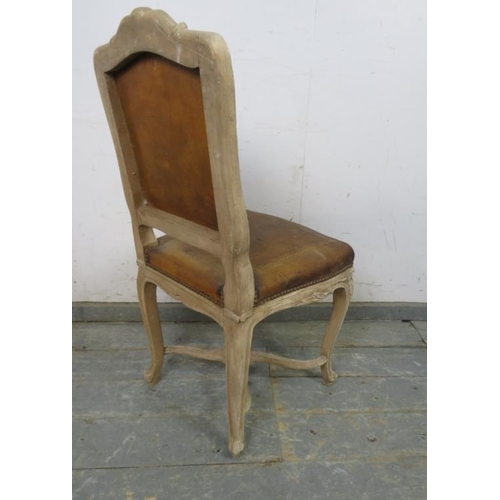 762 - An antique French boudoir chair, the carved and painted frame retaining the original distressed brow... 