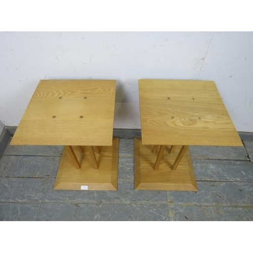 764 - A pair of contemporary light oak square bedside tables, the chamfered tops above cluster columns wit... 