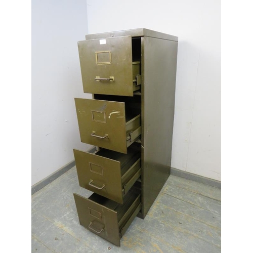 765 - A vintage steel filing cabinet painted khaki green, housing four deep drawers with brass handles and... 