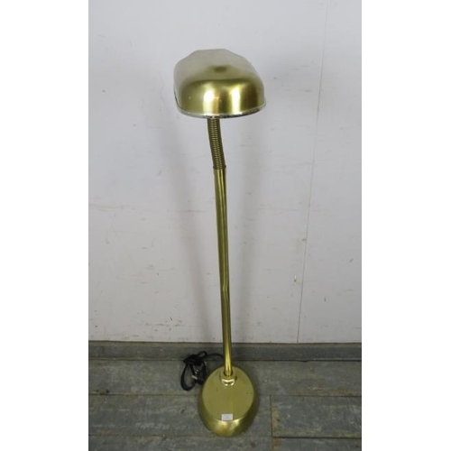 768 - A vintage brushed brass floor-standing reading lamp with adjustable goose neck, on a plinth base.
H1... 