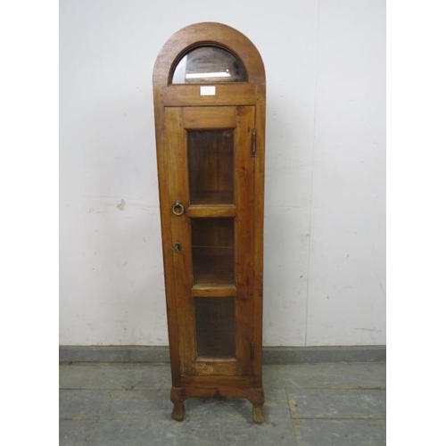 770 - A small Continental fruitwood dome topped display cabinet, the glazed door opening onto two fitted s... 