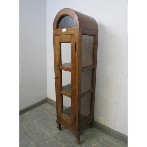 770 - A small Continental fruitwood dome topped display cabinet, the glazed door opening onto two fitted s... 