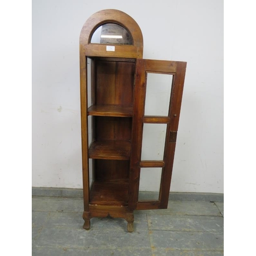 770 - A small Continental fruitwood dome topped display cabinet, the glazed door opening onto two fitted s... 