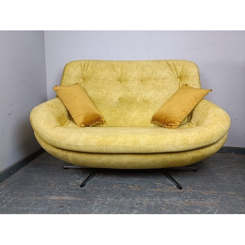 771 - A mid-century two-seater sofa/loveseat, reupholstered in buttoned yellow velvet material, on splayed... 