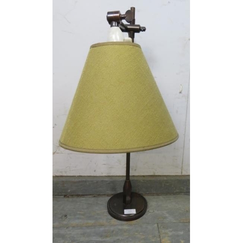 772 - A mid-century Danish bronze adjustable table lamp, on a circular plinth base. Stamped PAT JH to unde... 