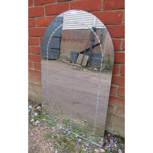 775 - A vintage Art Deco Revival arched wall mirror with engraved border and corner decoration depicting w... 