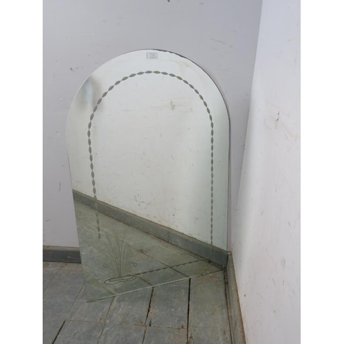 775 - A vintage Art Deco Revival arched wall mirror with engraved border and corner decoration depicting w... 