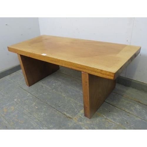 779 - A mid-century rectangular coffee table, constructed from heavy cuts of solid teak, on stile supports... 