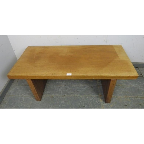 779 - A mid-century rectangular coffee table, constructed from heavy cuts of solid teak, on stile supports... 