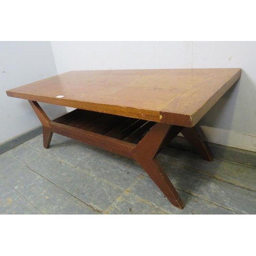 780 - A mid-century pitch pine coffee table, on canted supports with a slatted under-tier shelf.  
H45cm W... 