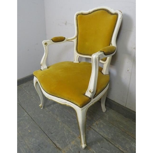 783 - A vintage French open-sided armchair painted in distressed white with gilt accents and upholstered i... 