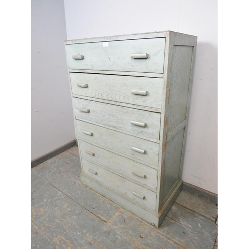 787 - A 1930s narrow oak chest of six long oak-lined drawers with bar handles, painted in a teal wash, on ... 