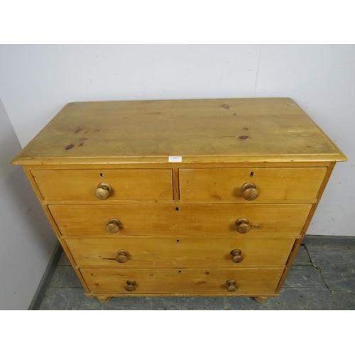 793 - An antique pine chest, housing two short and three long graduated drawers with turned wooden handles... 