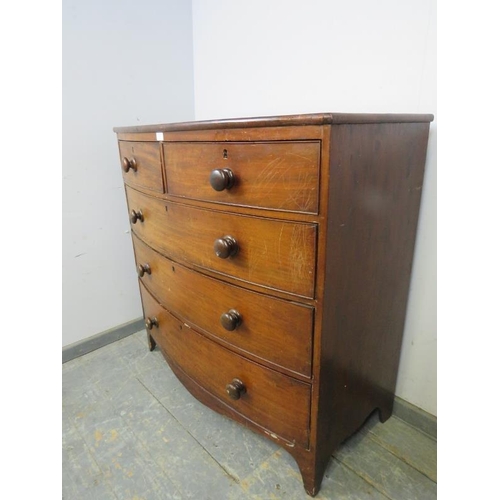 794 - A George III mahogany bow fronted chest of two short and three long graduated cock-beaded drawers re... 