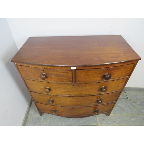 794 - A George III mahogany bow fronted chest of two short and three long graduated cock-beaded drawers re... 