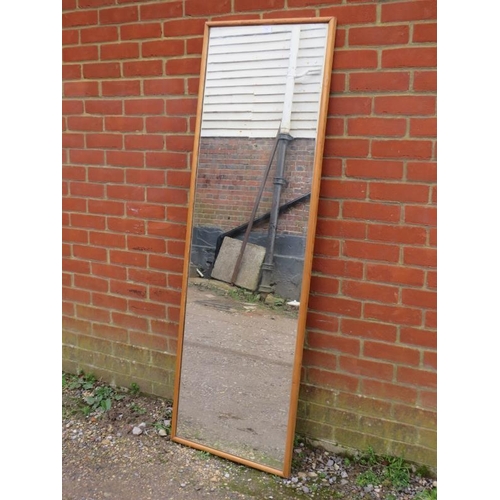 798 - A large rectangular wall mirror, within an antique pine surround. 
H171cm W54cm D4cm approx.
Conditi... 