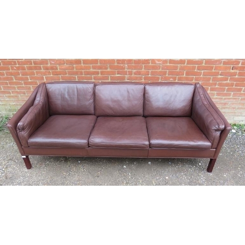 808 - A mid-century Danish three-seater sofa by Grandt Mobelfabrik, upholstered in brown leather, on squar... 