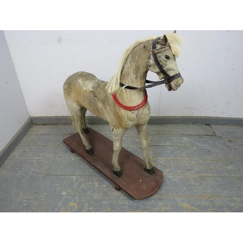 810 - A Victorian pony skin model of a horse, on a plinth base. 
H82cm W80cm D26cm approx.
Condition repor... 