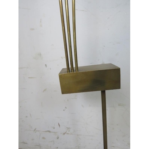 815 - A mid-century brass abstract floor-standing sculpture, on an ebonised weighted plinth base. 
H136cm ... 